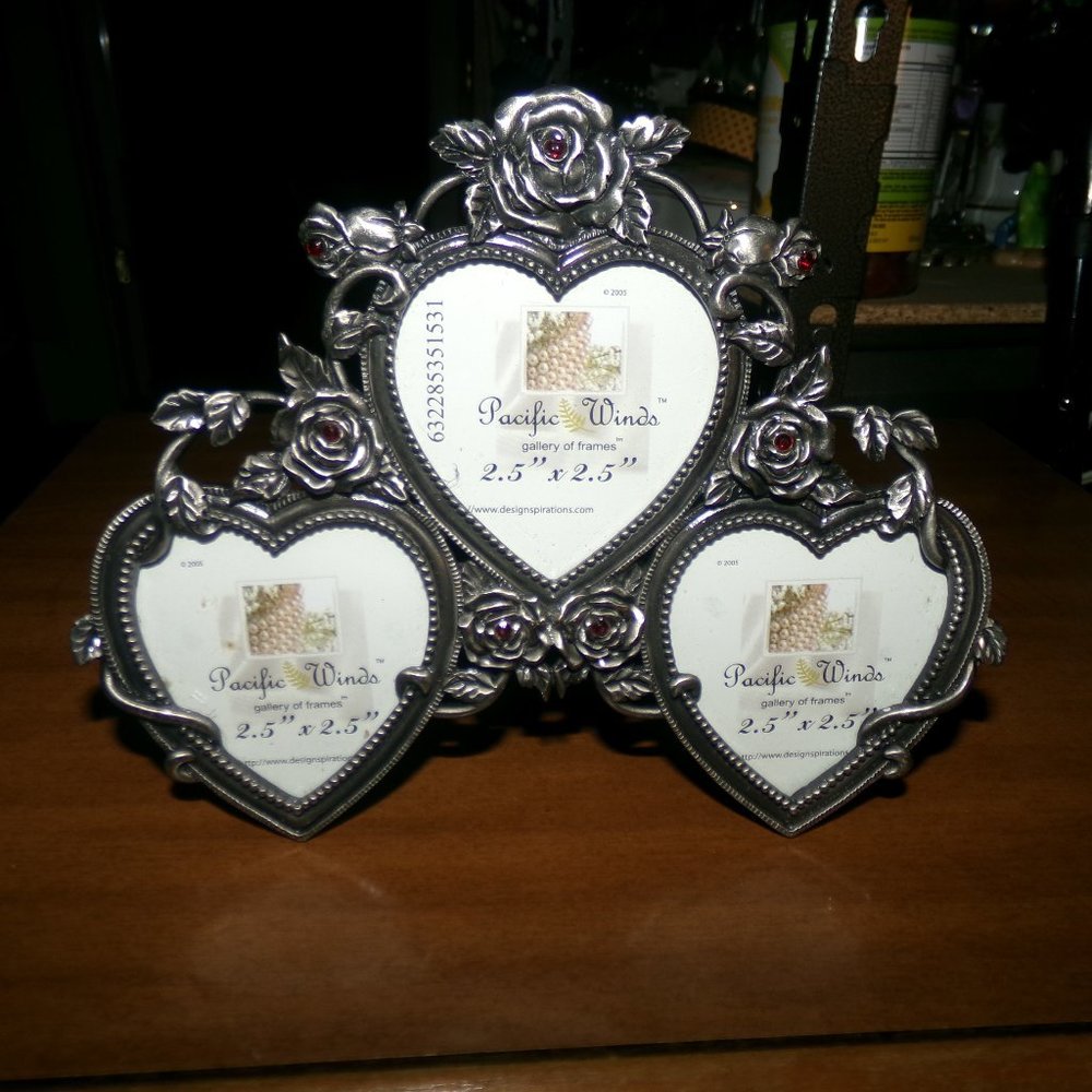 metal frame. Roses & hearts holds 3 pictures.